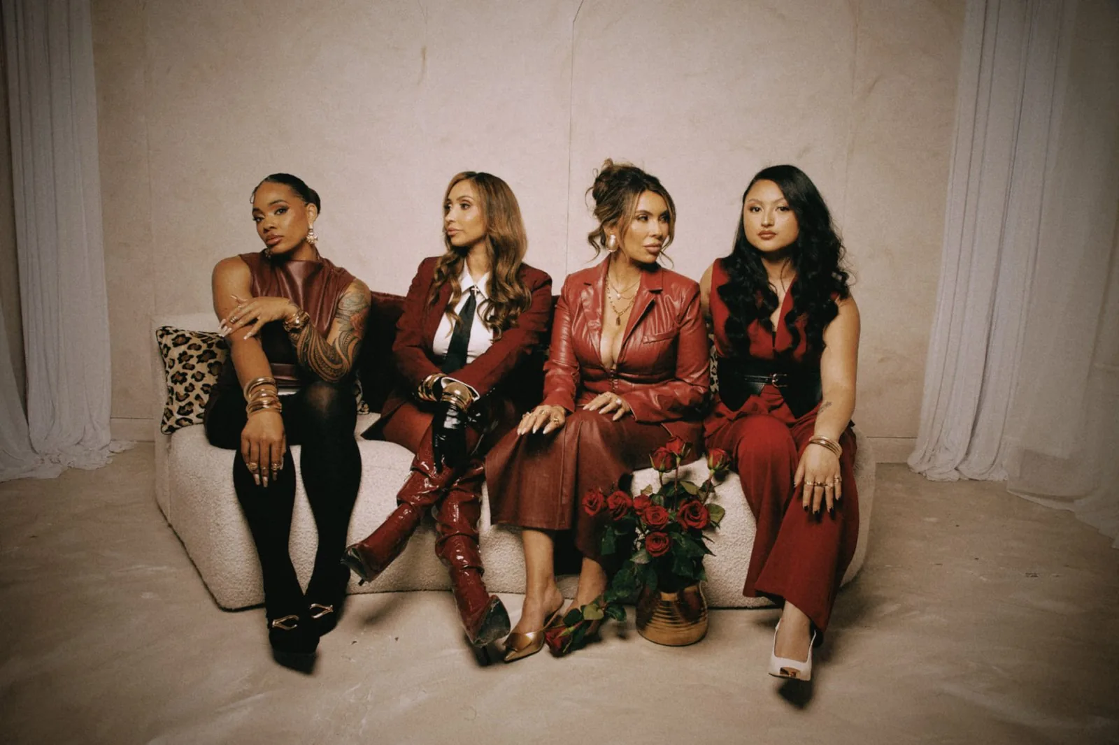 The Aesthetx Haus team seated with red roses in the Walnut Creek studio